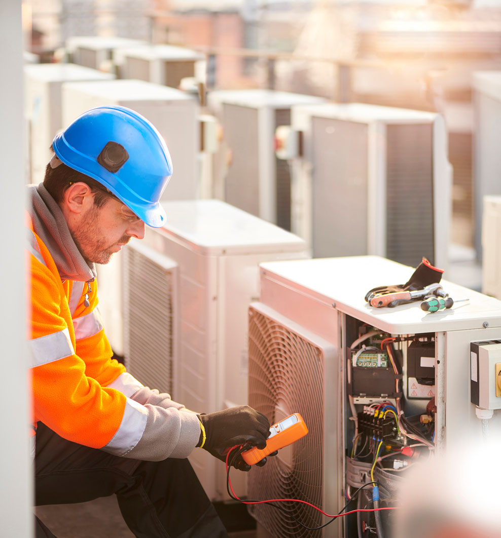 Man working on air conditioning unit